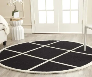 SAFAVIEH Cambridge Collection Area Rug - 6' Round, Black & Ivory, Handmade Moroccan Trellis Wool, Ideal for High Traffic Areas in Living Room, Bedroom (CAM136E)